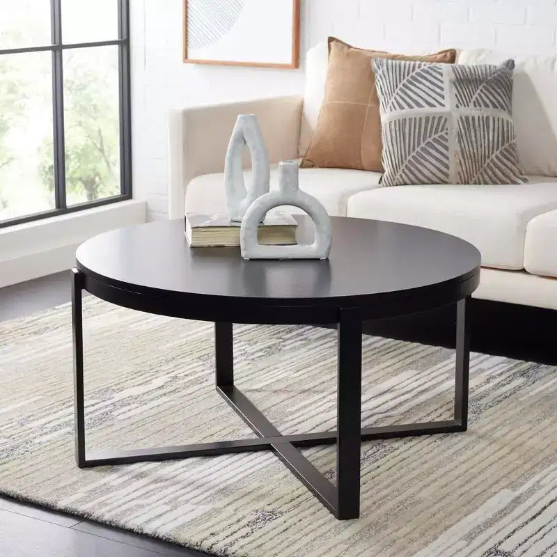 Table basse ronde avec piétement métallique entrecroisé
